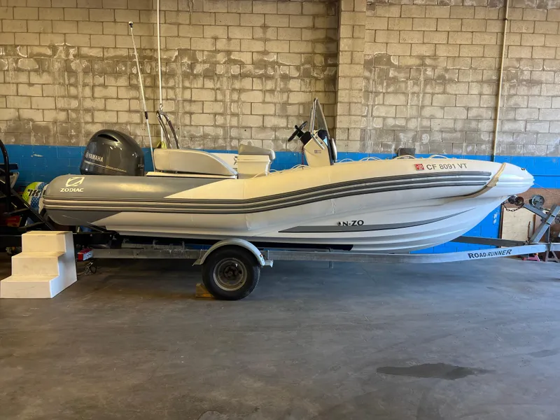 Slide: The Image of 2020 Zodiac N-ZO 600 boat on trailer in garage setting. - 2