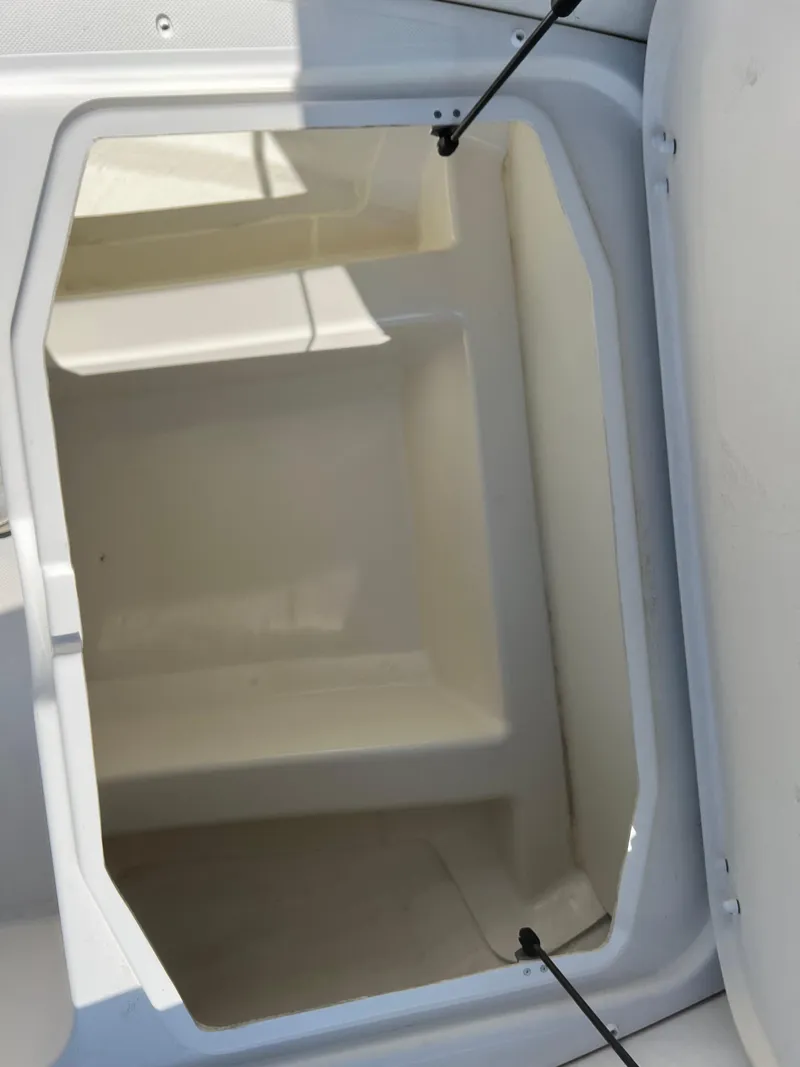 Slide: The Image of 2020 Zodiac N-ZO 600 boat storage compartment, open and empty. - 21