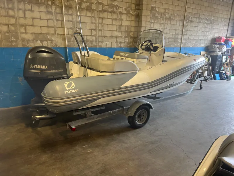 Slide: The Image of 2020 Zodiac N-ZO 600 boat with Yamaha engine on trailer in garage. - 24