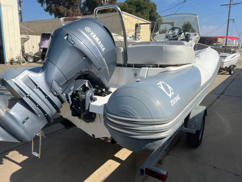 Slide: The Image of 2020 Zodiac N-ZO 600 boat with Yamaha outboard motor on a trailer. - 6