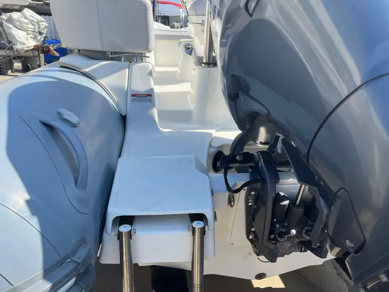 Slide: The Image of 2020 Zodiac N-ZO 600 boat interior with engine and seating area. - 8