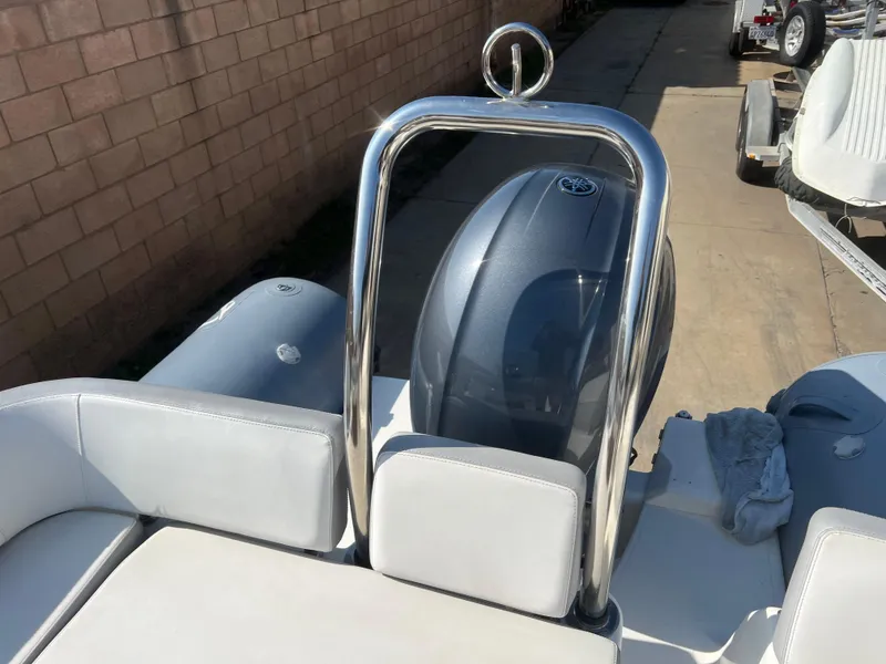 Slide: The Image of 2020 Zodiac N-ZO 600 boat with sleek design and modern engine, parked outdoors. - 9