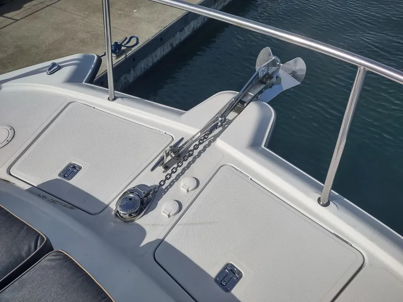 Slide: The Image of 2005 Glacier Bay 3490 Ocean Runner boat deck with anchor chain and storage compartments. - 15