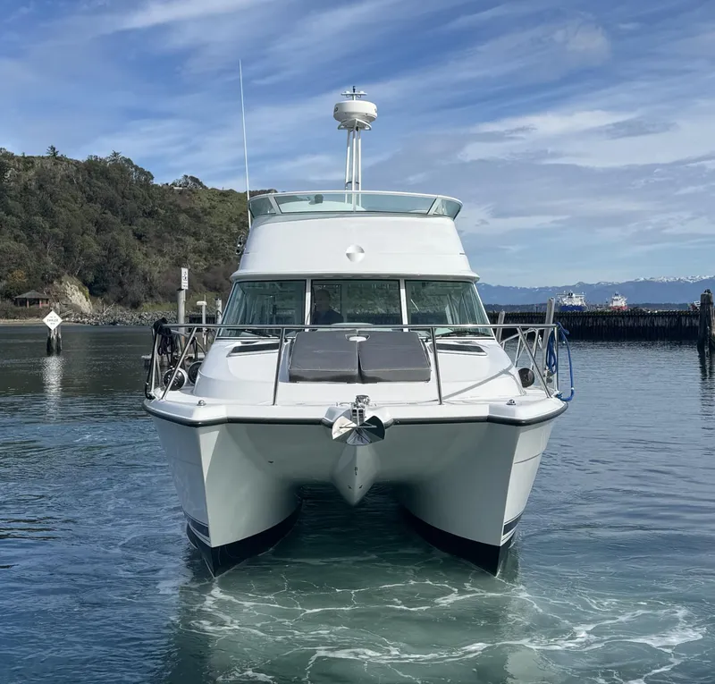 Slide: The Image of 2005 Glacier Bay 3490 Ocean Runner catamaran on calm water, front view. - 2