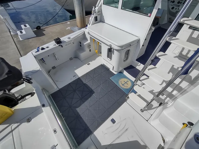 Slide: The Image of 2005 Glacier Bay 3490 Ocean Runner boat interior with fishing equipment and seating area. - 22