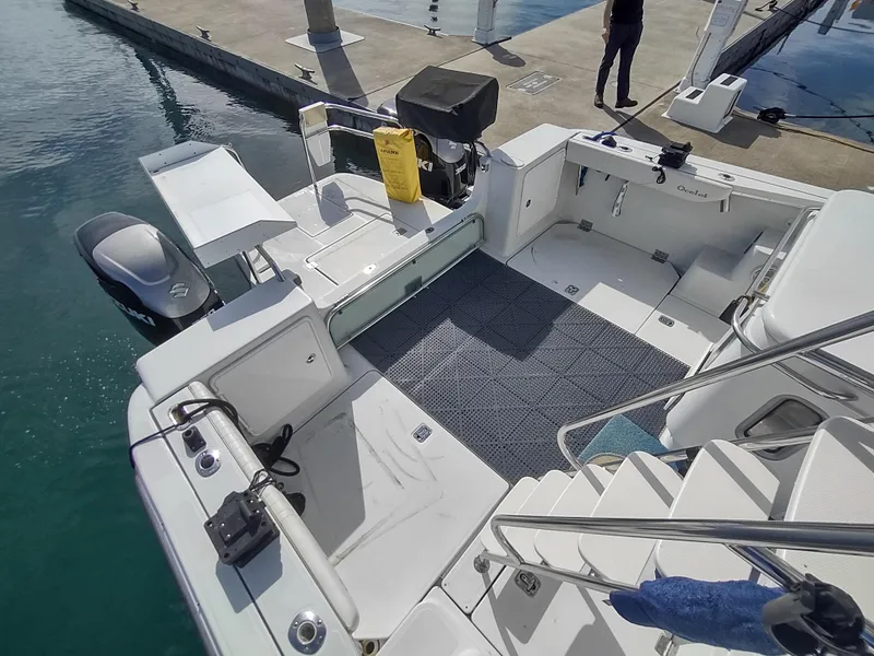 Slide: The Image of 2005 Glacier Bay 3490 Ocean Runner boat docked, featuring spacious deck and modern amenities. - 23