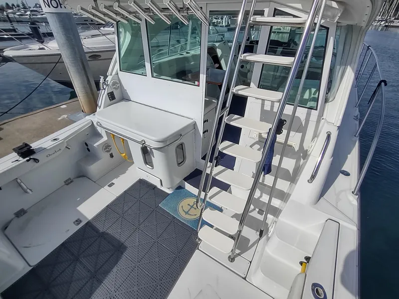 Slide: The Image of 2005 Glacier Bay 3490 Ocean Runner boat interior with ladder and fishing equipment. - 24