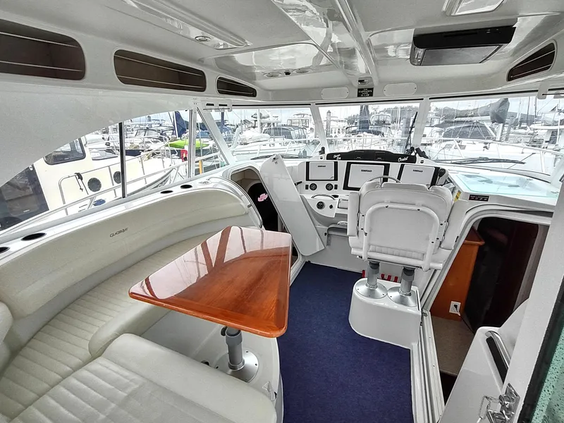 Slide: The Image of Interior of 2005 Glacier Bay 3490 Ocean Runner boat with seating and helm. - 40