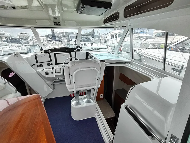 Slide: The Image of Interior of 2005 Glacier Bay 3490 Ocean Runner boat with modern helm and seating. - 41