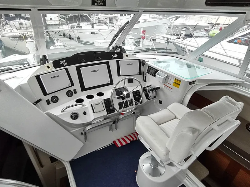 Slide: The Image of Helm of 2005 Glacier Bay 3490 Ocean Runner with modern navigation equipment and comfortable seating. - 43