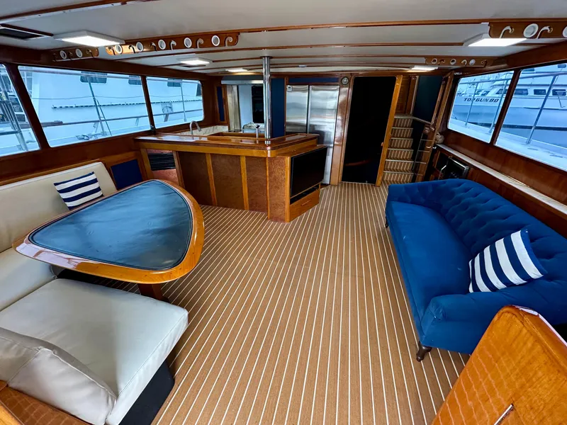 Slide: The Image of Interior of a 1967 Elliott Yachtfisher with elegant wood finishes and modern seating. - 1