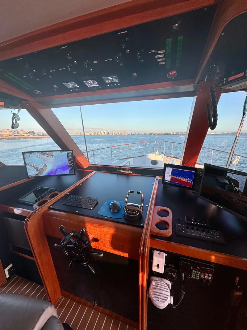 Slide: The Image of 1967 Elliott Yachtfisher cockpit with navigation equipment, overlooking the ocean. - 5