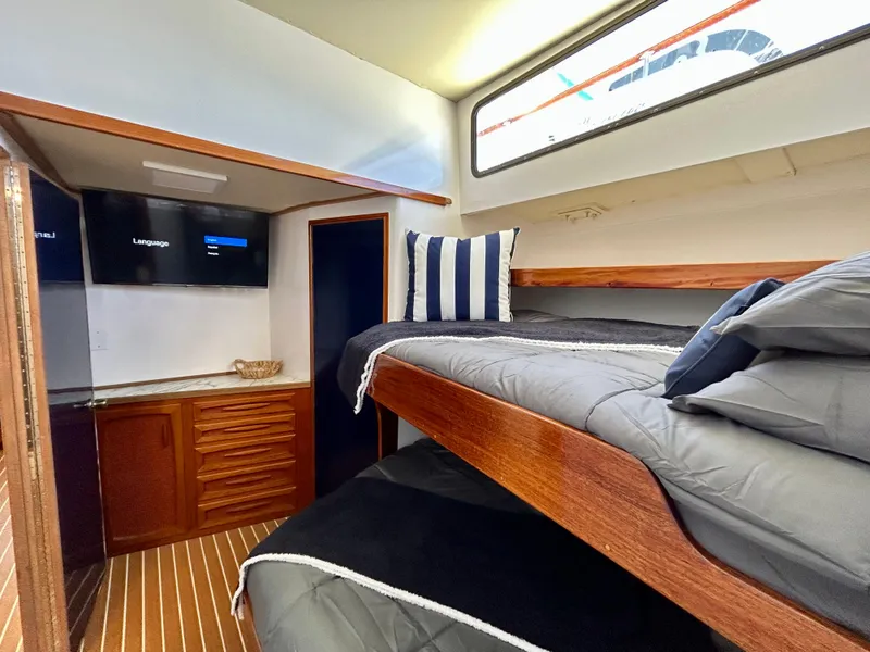 Slide: The Image of Interior of 1967 Elliott Yachtfisher with bunk beds, wood cabinetry, and modern amenities. - 7