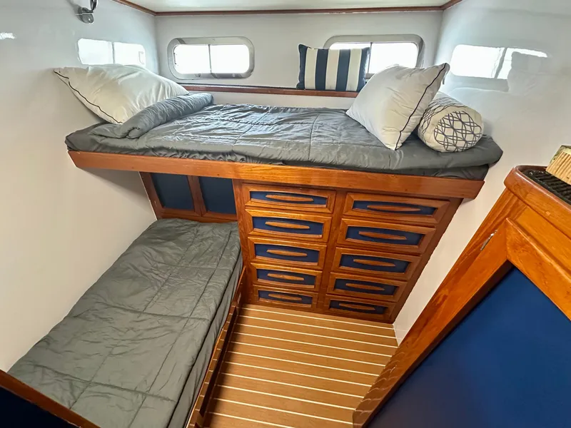 Slide: The Image of Cozy cabin interior of 1967 Elliott Yachtfisher with bunk beds and wooden storage drawers. - 8