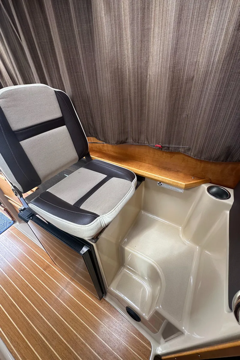 Slide: The Image of 2016 Cutwater 28 interior with seating and wood accents. - 16