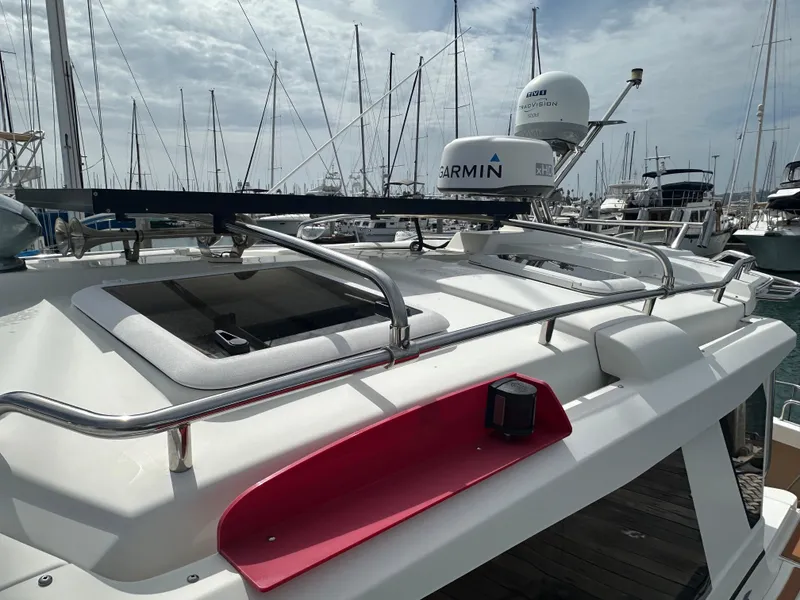 Slide: The Image of 2016 Cutwater 28 boat with Garmin radar, docked in a marina with sailboats. - 4