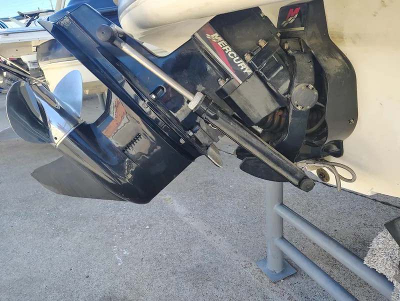 Slide: The Image of Outboard motor of a 2000 Maxum 1900 SR boat on display. - 11