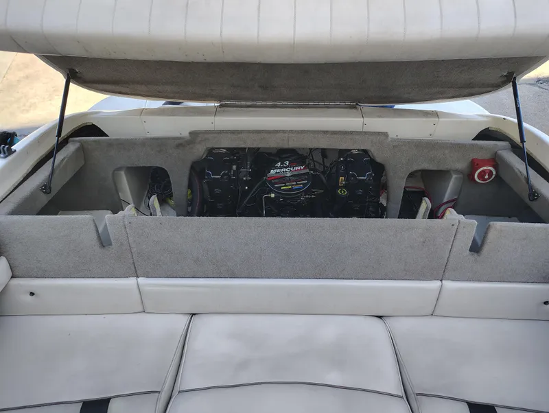 Slide: The Image of 2000 Maxum 1900 SR boat engine compartment with open hatch, showcasing interior details. - 7