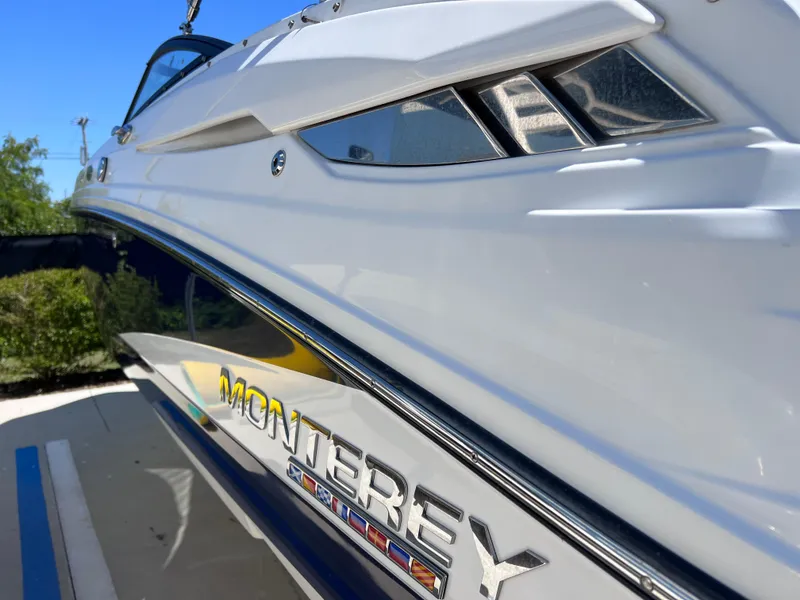 Slide: The Image of 2022 Monterey M45 boat with sleek design and Verado engine, close-up view. - 10