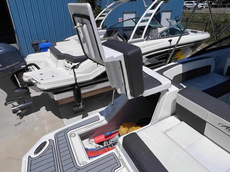Slide: The Image of 2022 Monterey M45 boat with storage compartment open, showcasing sleek design and minimal usage. - 14