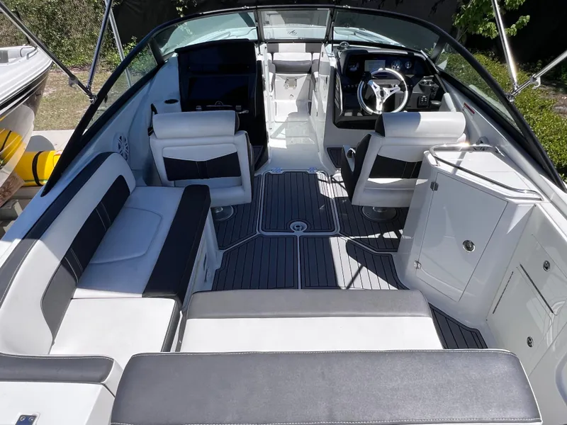 Slide: The Image of 2022 Monterey M45 boat interior with sleek seating and modern dashboard. - 15