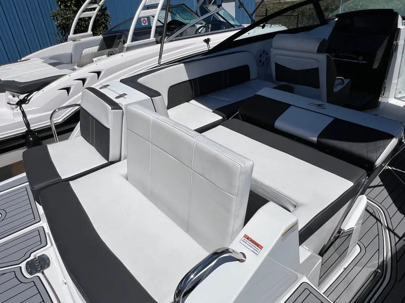 Slide: The Image of 2022 Monterey M45 boat interior with sleek white and black seating, powered by 250 Verado. - 19