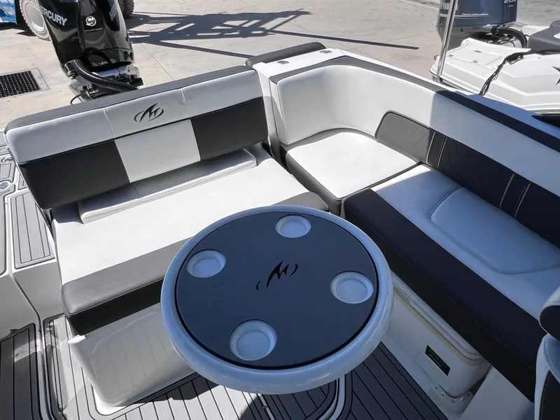 Slide: The Image of 2022 Monterey M45 boat interior with seating and table, powered by 250 Verado, 140 hours. - 21