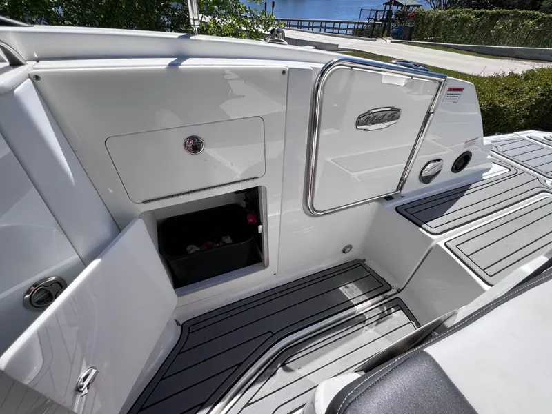 Slide: The Image of 2022 Monterey M45 boat interior with storage compartments and sleek design. - 28