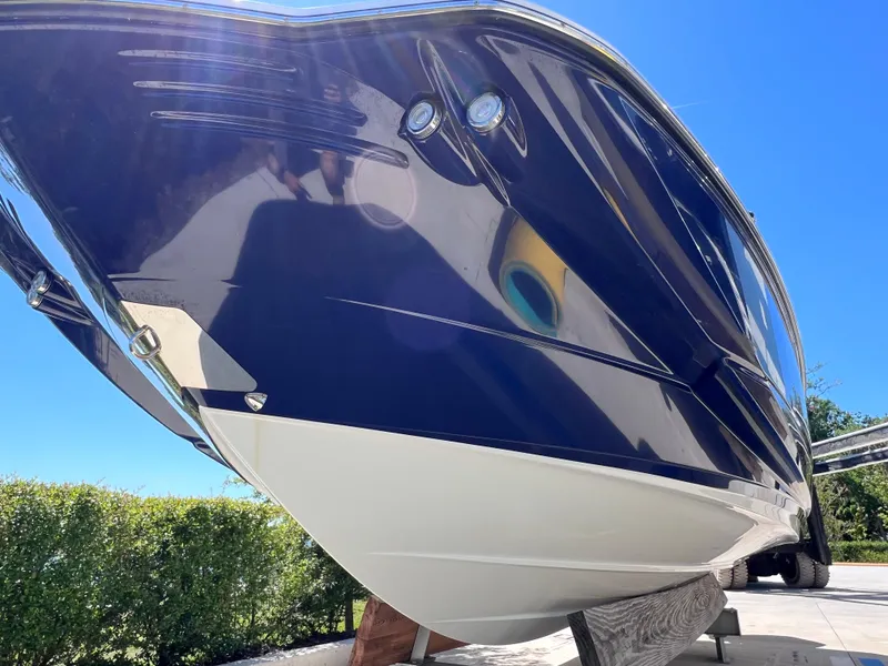 Slide: The Image of 2022 Monterey M45 boat with 250 Verado engine, 140 hours, sleek blue hull. - 3