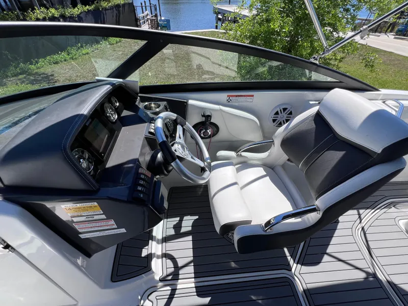 Slide: The Image of 2022 Monterey M45 boat interior with sleek dashboard and comfortable seating. - 38