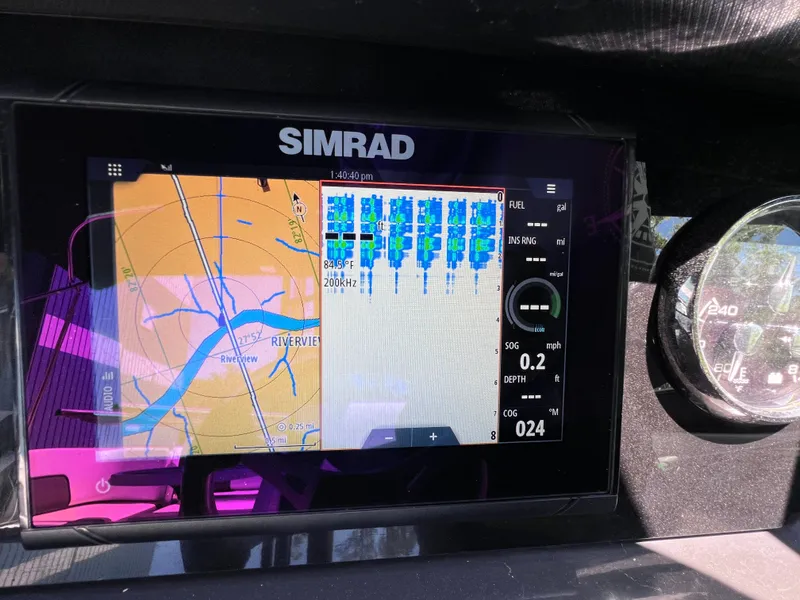 Slide: The Image of Simrad navigation display on 2022 Monterey M45 boat, showing river map and sonar data. - 41