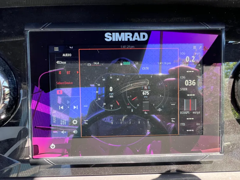 Slide: The Image of Simrad display on 2022 Monterey M45 boat, showing navigation and audio controls. - 43