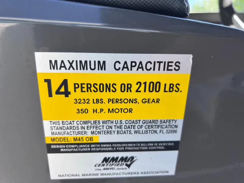 Slide: The Image of 2022 Monterey M45 boat capacity label, 14 persons or 2100 lbs, 350 HP motor. - 49