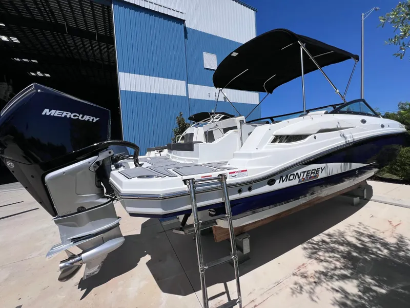 Slide: The Image of 2022 Monterey M45 boat with Mercury 250 Verado engine, docked outdoors. - 7