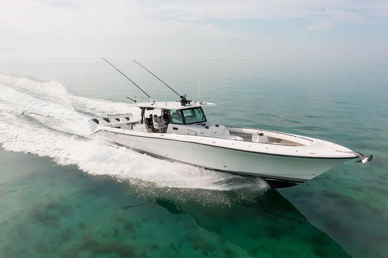 Slide: The Image of Luxurious cabin interior of 2019 HCB 53 boat with cozy seating and TV. - 12