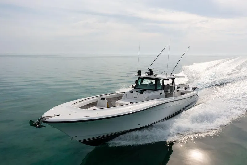 Slide: The Image of 2019 HCB 53 boat cruising on calm ocean waters. - 16