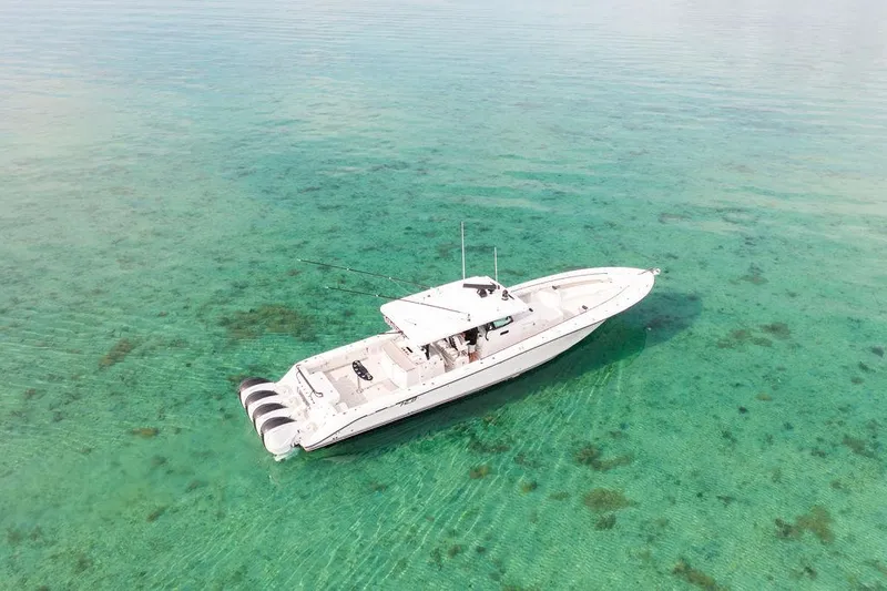 Slide: The Image of Aerial view of 2019 HCB 53 boat on clear turquoise water. - 23