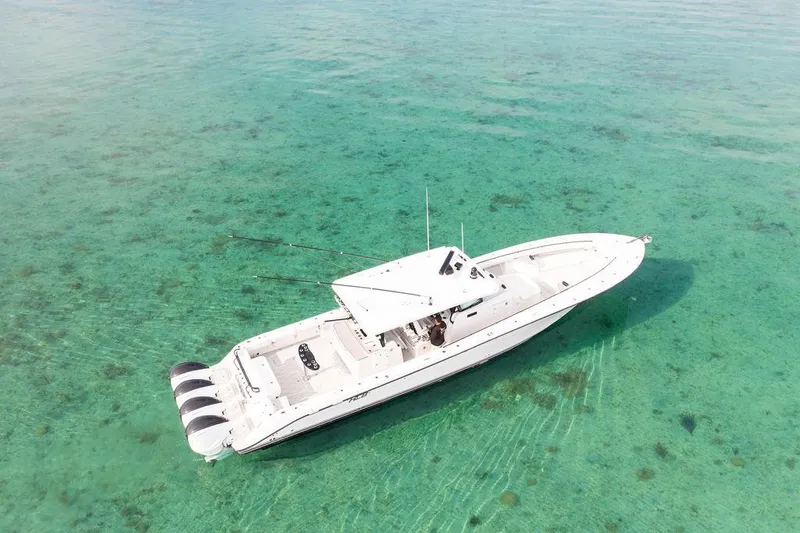 Slide: The Image of Aerial view of 2019 HCB 53 boat on clear turquoise water. - 24