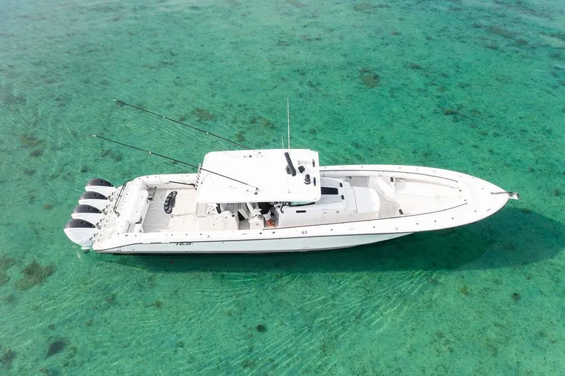 Slide: The Image of 2019 HCB 53 boat on clear turquoise water, aerial view. - 25