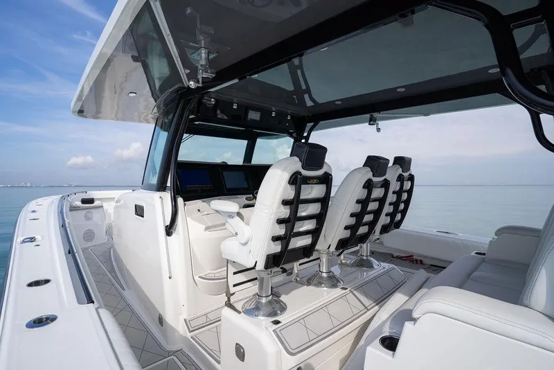 Slide: The Image of 2019 HCB 53 boat interior with modern seating and navigation equipment. - 34