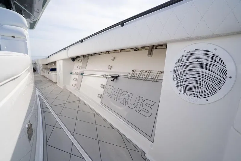 Slide: The Image of 2019 HCB 53 boat deck with speaker and storage compartments. - 47