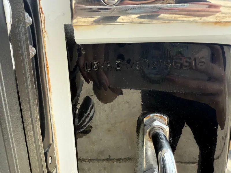 Slide: The Image of 2016 Nor-Tech 392 Super Fish Center Console boat detail with visible serial number. - 12