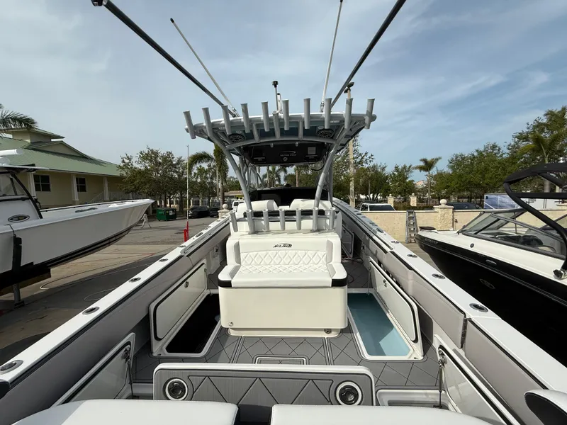 Slide: The Image of 2016 Nor-Tech 392 Super Fish Center Console boat with spacious deck and seating. - 15