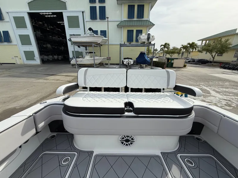 Slide: The Image of 2016 Nor-Tech 392 Super Fish Center Console boat interior with cushioned seating. - 21