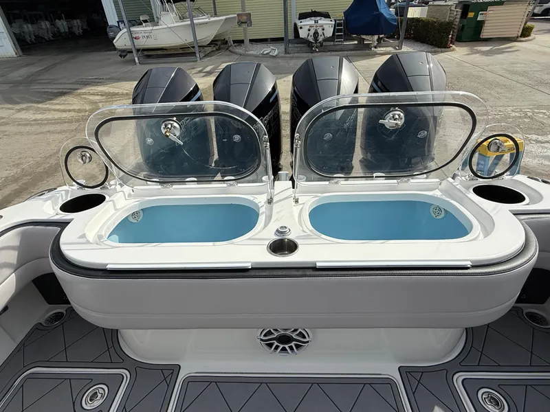 Slide: The Image of 2016 Nor-Tech 392 Super Fish Center Console with dual livewells and powerful outboard engines. - 26