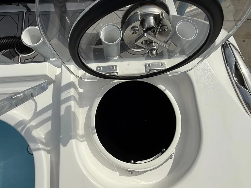 Slide: The Image of 2016 Nor-Tech 392 Super Fish Center Console livewell with open lid and rod holders. - 27