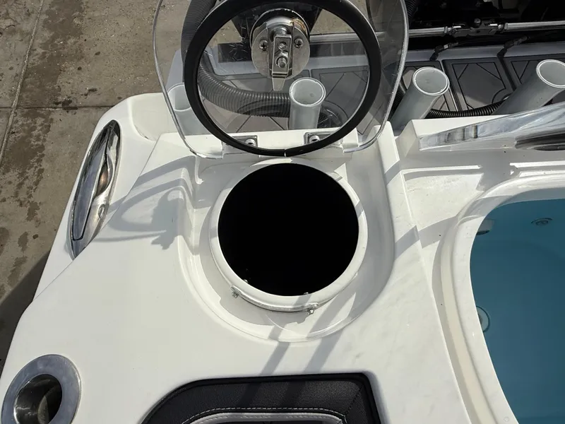 Slide: The Image of 2016 Nor-Tech 392 Super Fish Center Console helm with steering wheel and storage compartment. - 28
