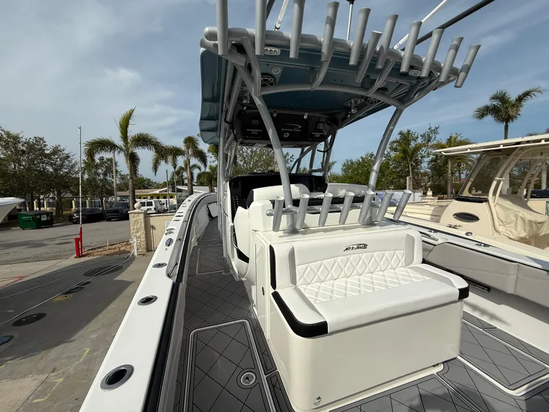 Slide: The Image of 2016 Nor-Tech 392 Super Fish Center Console boat with seating and rod holders. - 29
