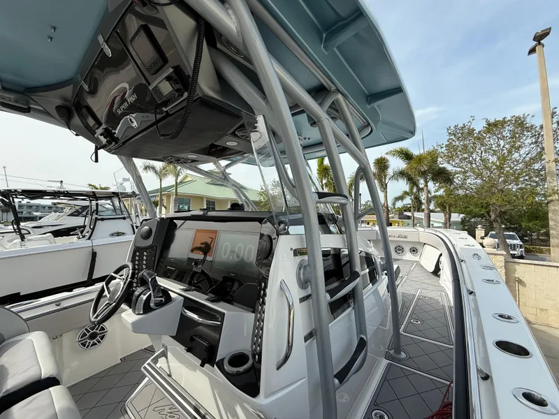 Slide: The Image of 2016 Nor-Tech 392 Super Fish Center Console boat interior with advanced navigation system. - 33