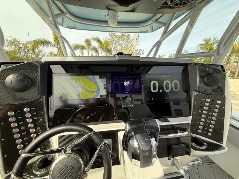 Slide: The Image of 2016 Nor-Tech 392 Super Fish Center Console dashboard with advanced navigation and control systems. - 36
